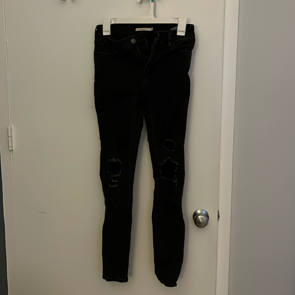 Levi’s Black size 26 701 ripped skinny jeans